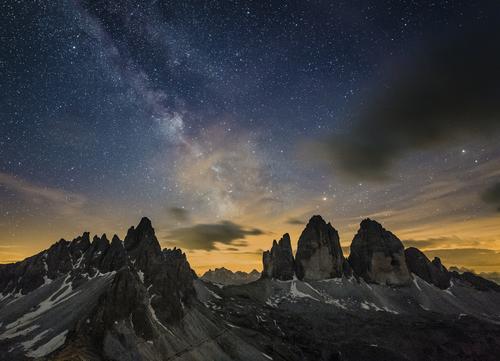 Mountain peaks in the Dolomites with starry sky
