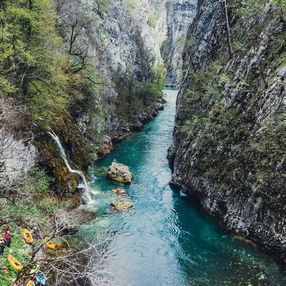 Wild river with paddlers