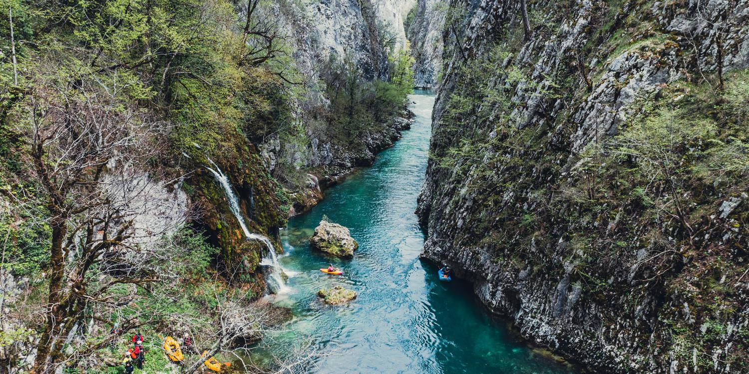 Wild river with paddlers