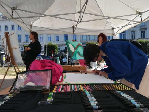 Female artists paint on the Place du Luxembourg