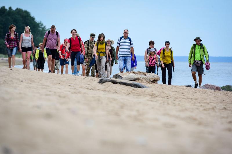 Hikers on a beach of the Baltic Sea