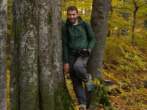 Gabriel Paun leaning aigainst a tree