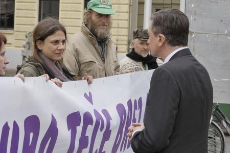 Environmental activists demonstrate with a banner