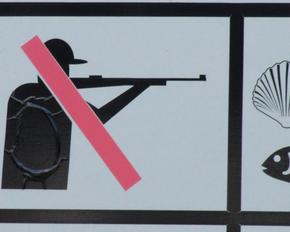 Hunting ban: sign showing a crossed-out hunter.
