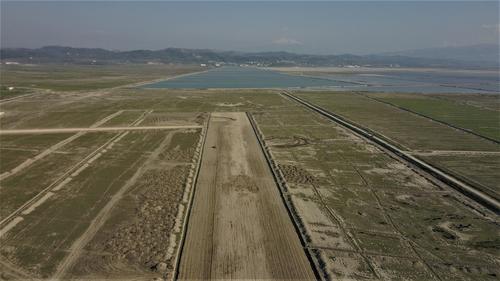 Bird's eye view of the runway of Vlora International Airport.