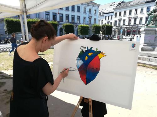 Artist paints the Blue Heart