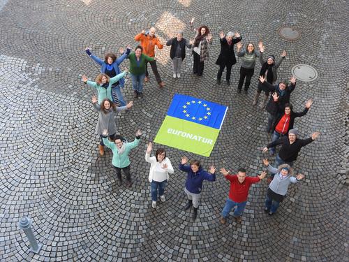 EuroNatur team with European flag