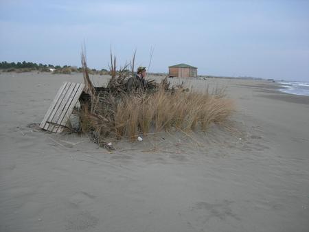 Poacher hidden on a beach on the Adriatic Sea