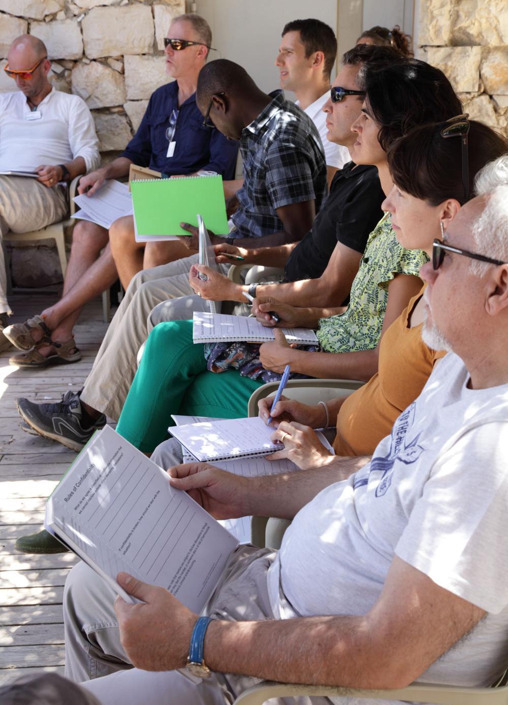 People listen to a lecture and make notes